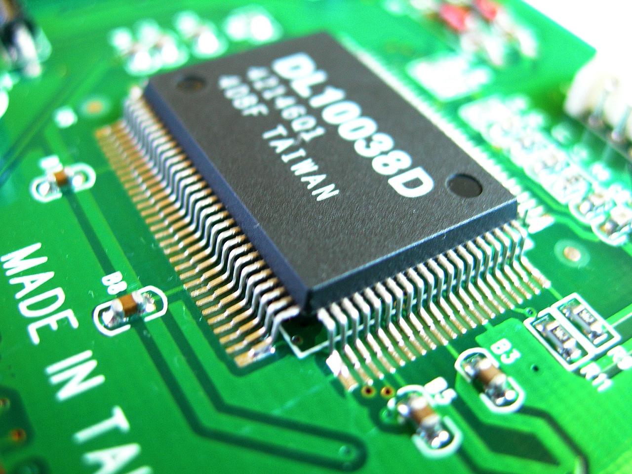 Close-up of a microchip on a circuit board Free Stock Photo | FreeImages